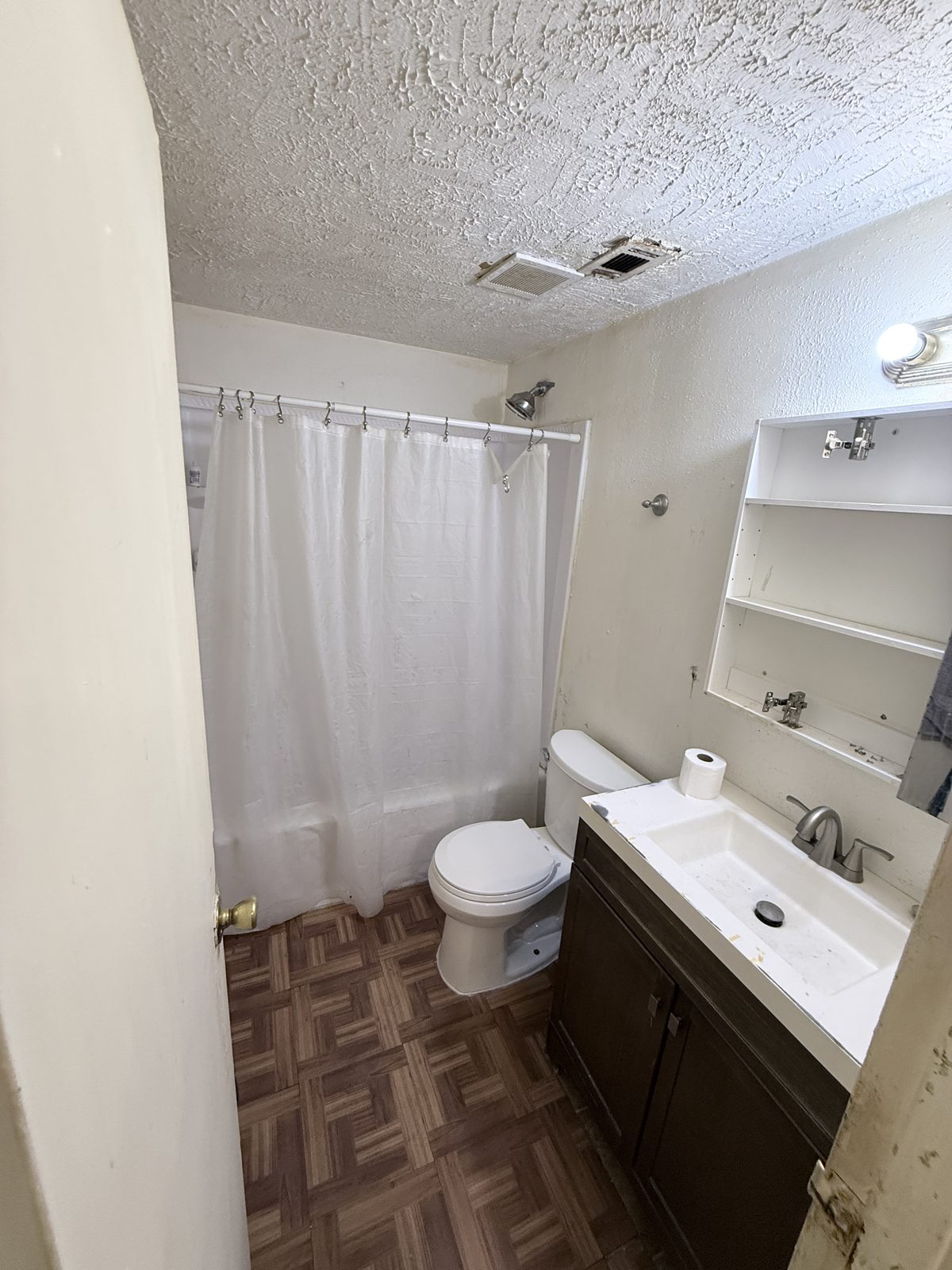 Worn bathroom before restoration