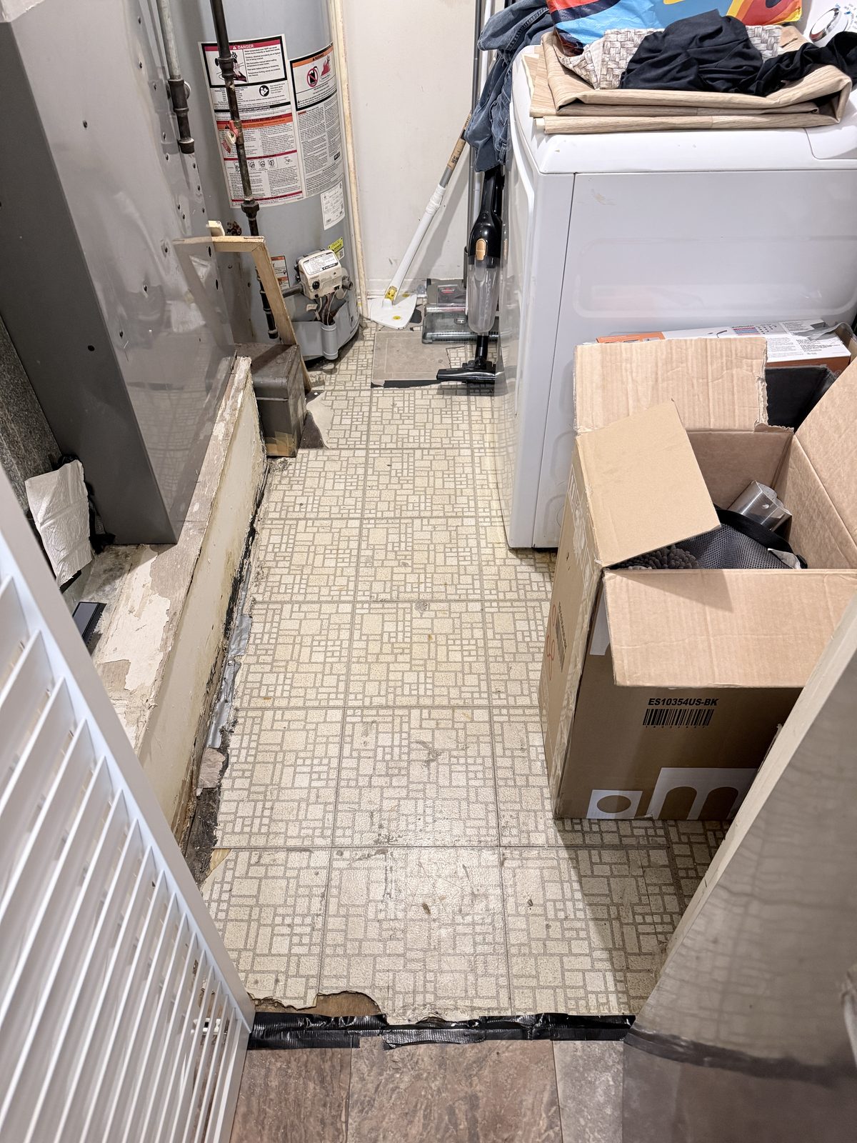 Dated kitchen flooring before restoration